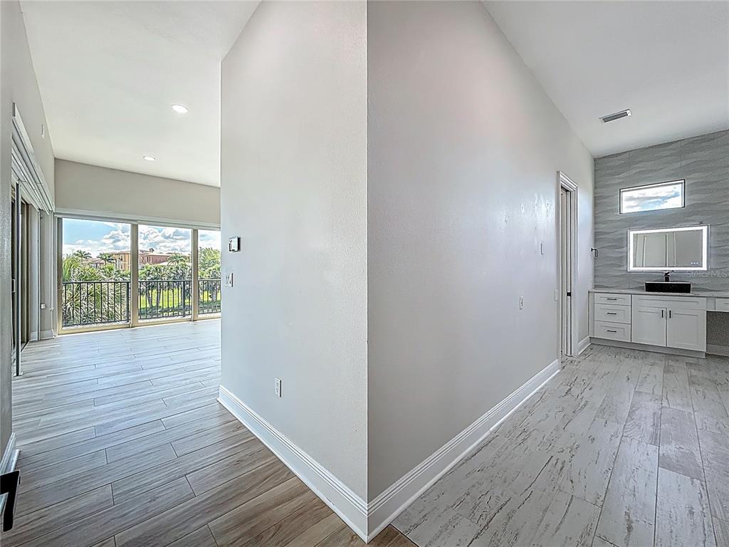 1329 Jumana Loop Apollo Beach, FL 33572 - Photo 21 of 40 a view of a kitchen with a sink and wooden floor
