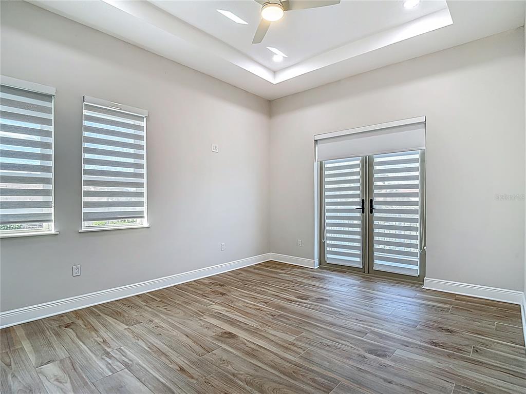 1329 Jumana Loop Apollo Beach, FL 33572 - Photo 27 of 40 wooden floor in an empty room with a window