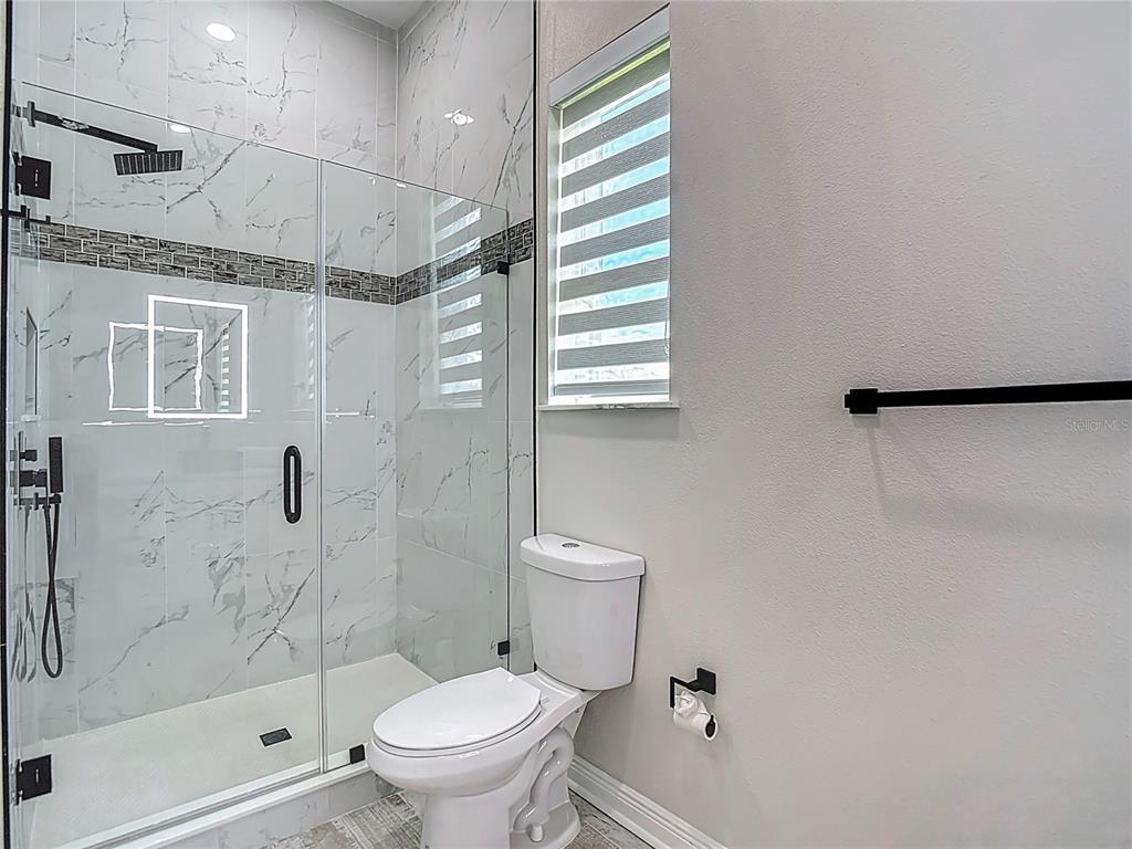 1329 Jumana Loop Apollo Beach, FL 33572 - Photo 29 of 40 a bathroom with a toilet and a shower