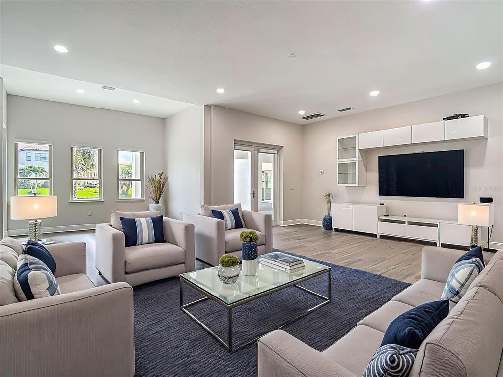 1329 Jumana Loop Apollo Beach, FL 33572 - Photo 37 of 40 a living room with furniture and a flat screen tv