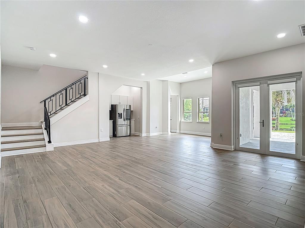 1329 Jumana Loop Apollo Beach, FL 33572 - Photo 40 of 40 a view of an empty room with wooden floor and a window