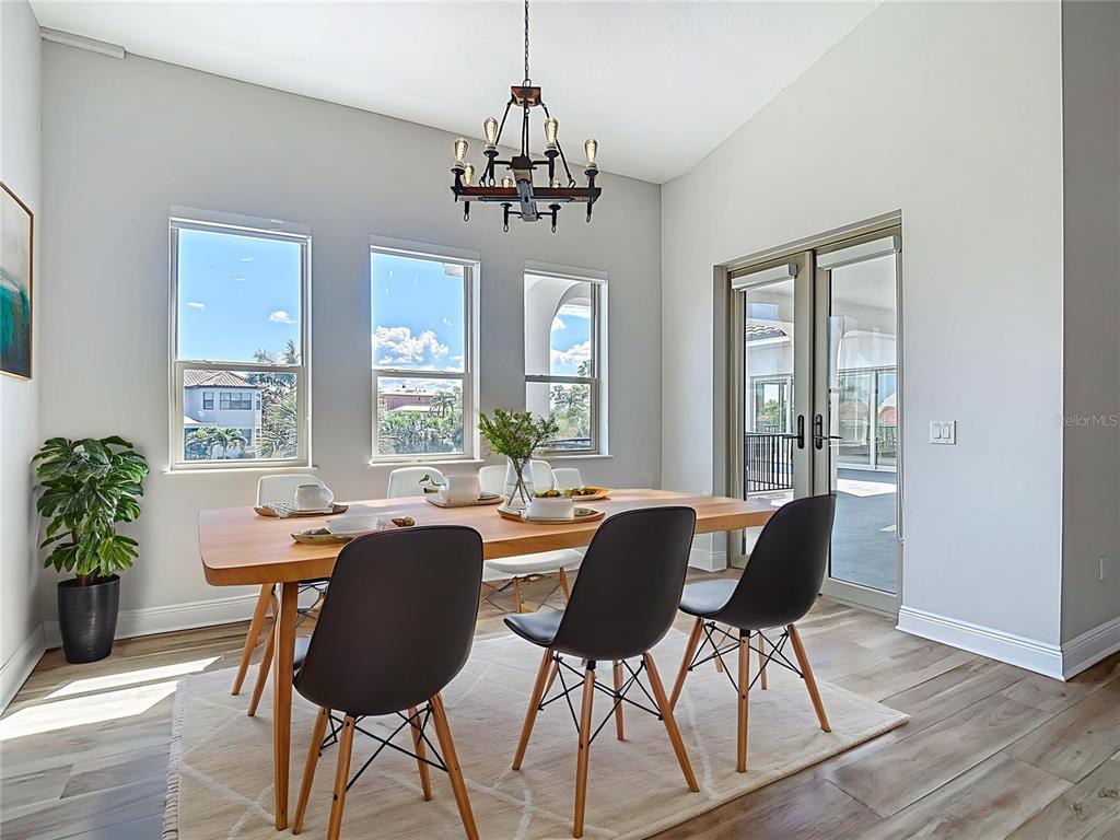 1329 Jumana Loop Apollo Beach, FL 33572 - Photo 10 of 40 a view of a dining room with furniture window and wooden floor