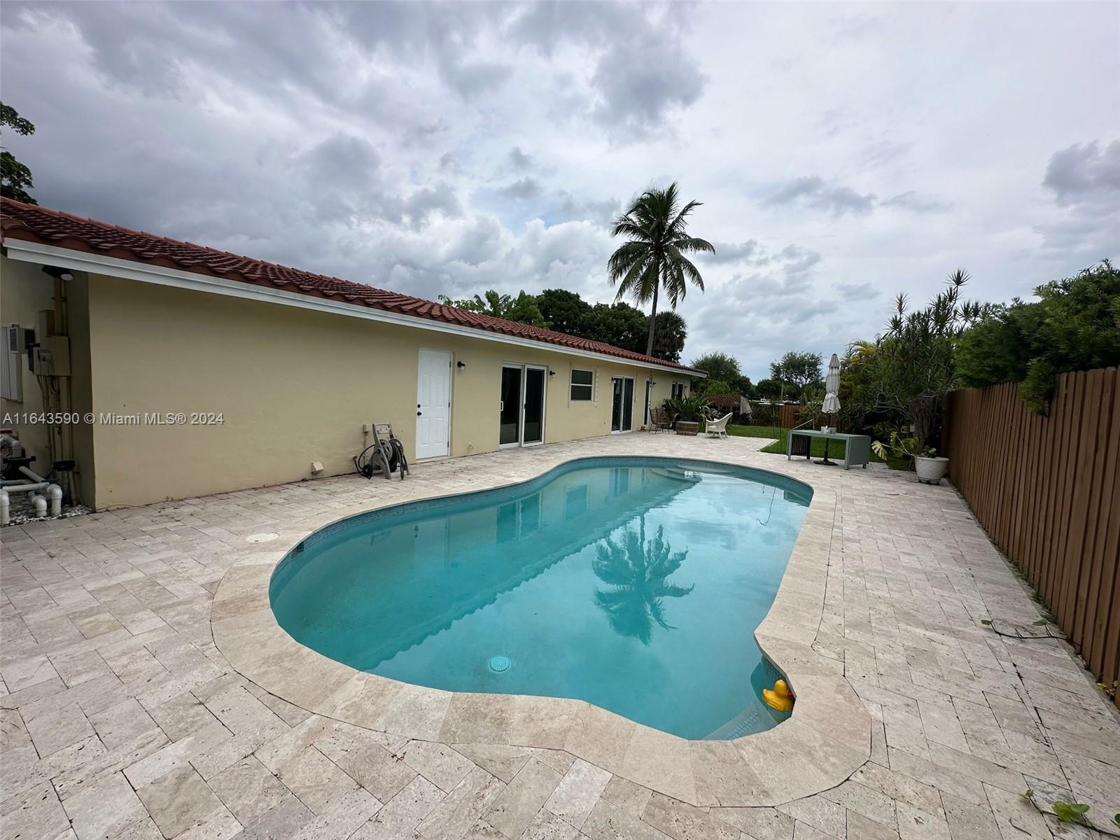 14200 Kendale Lakes Drive Miami, FL 33183 - Photo 18 of 21 a view of a house with swimming pool
