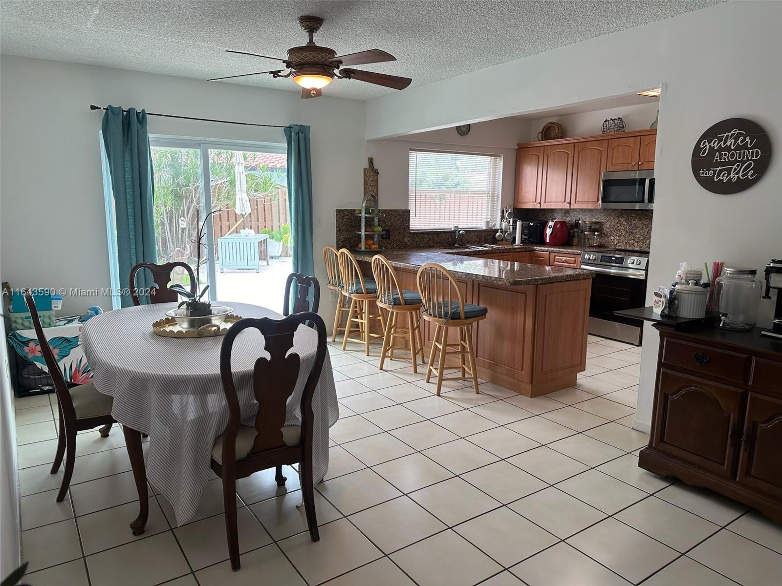 14200 Kendale Lakes Drive Miami, FL 33183 - Photo 2 of 21 a view of a dining room with furniture
