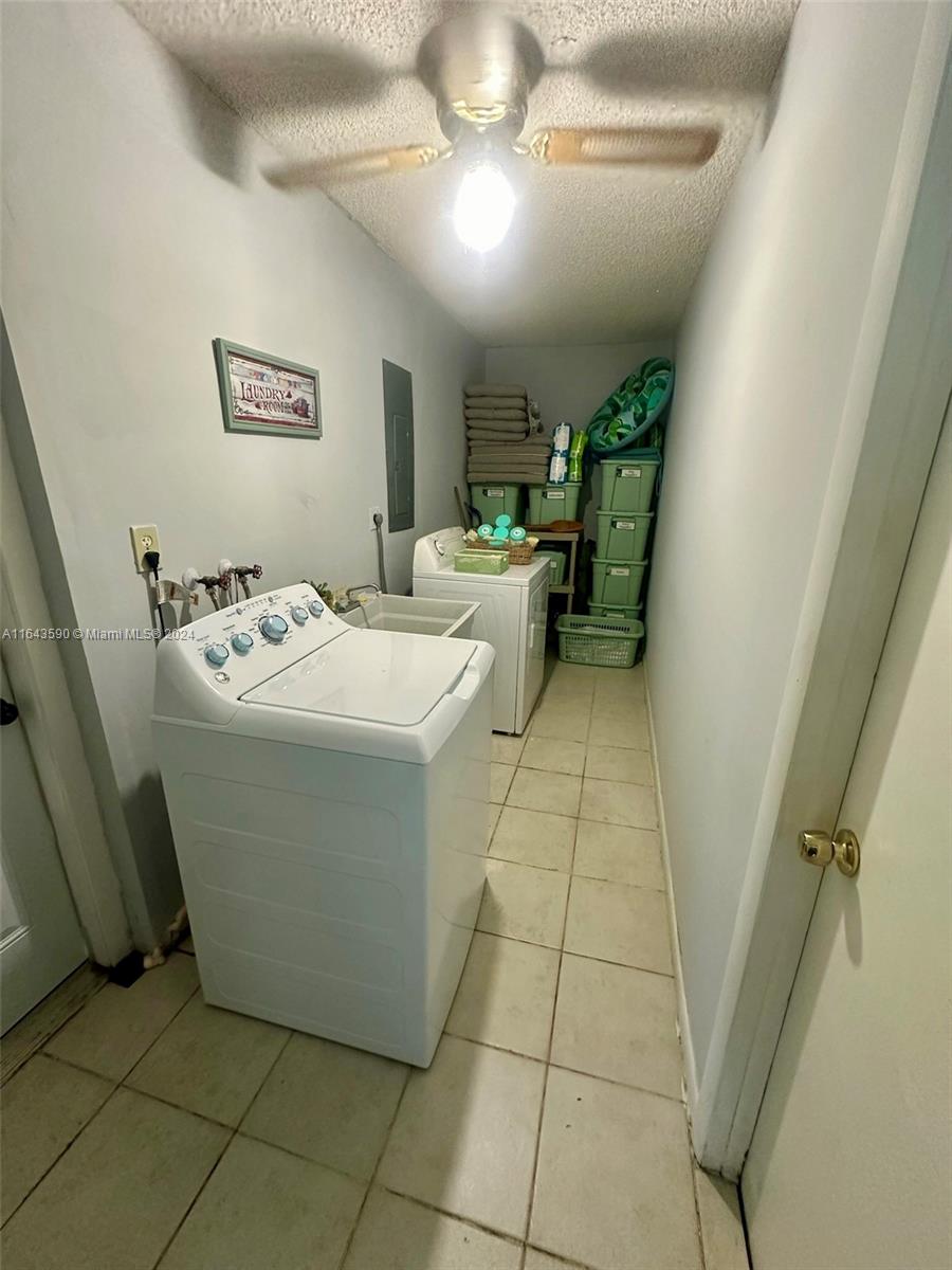 14200 Kendale Lakes Drive Miami, FL 33183 - Photo 21 of 21 a utility room with washer and dryer