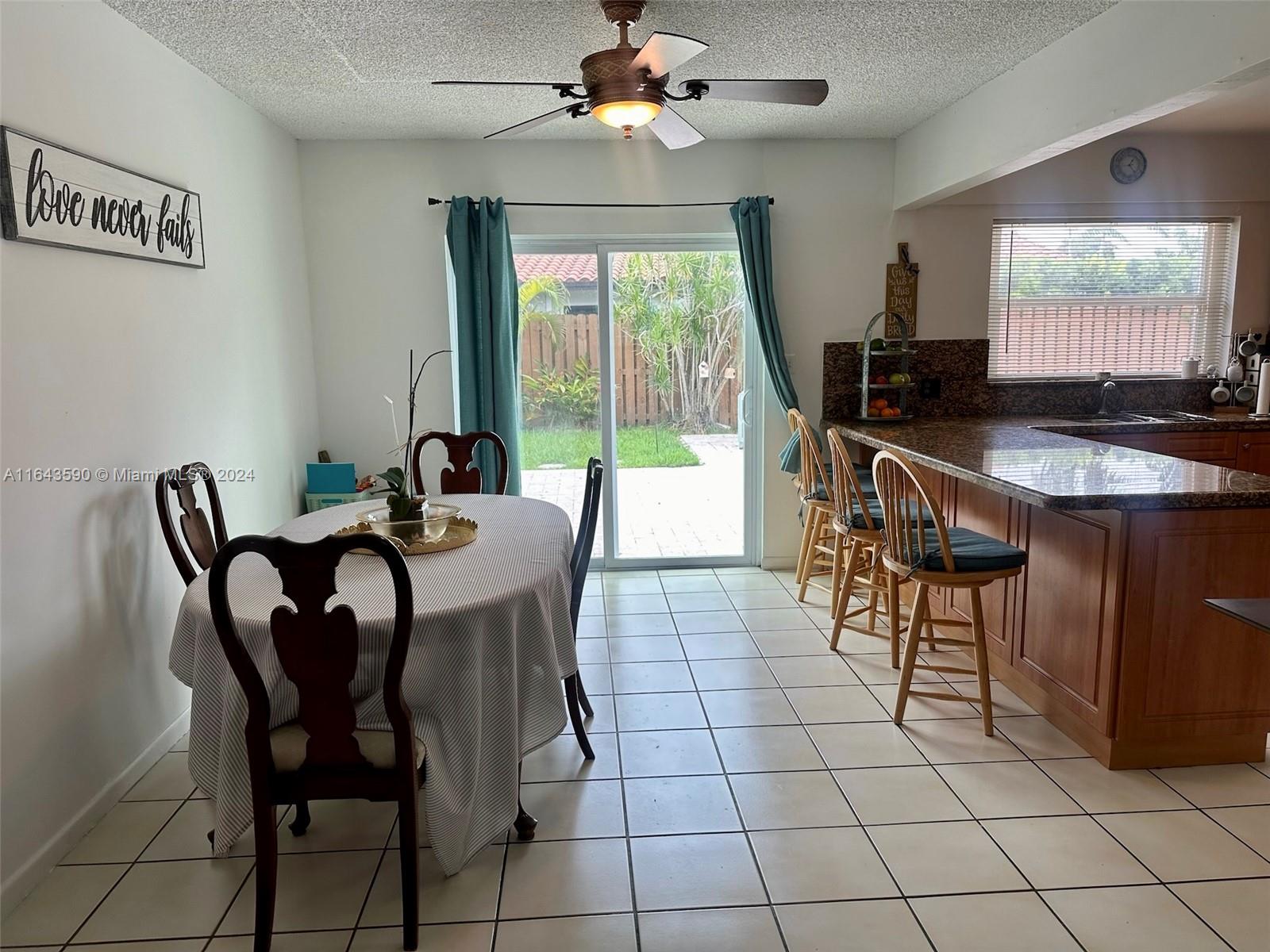 14200 Kendale Lakes Drive Miami, FL 33183 - Photo 5 of 21 a view of a dining room with furniture