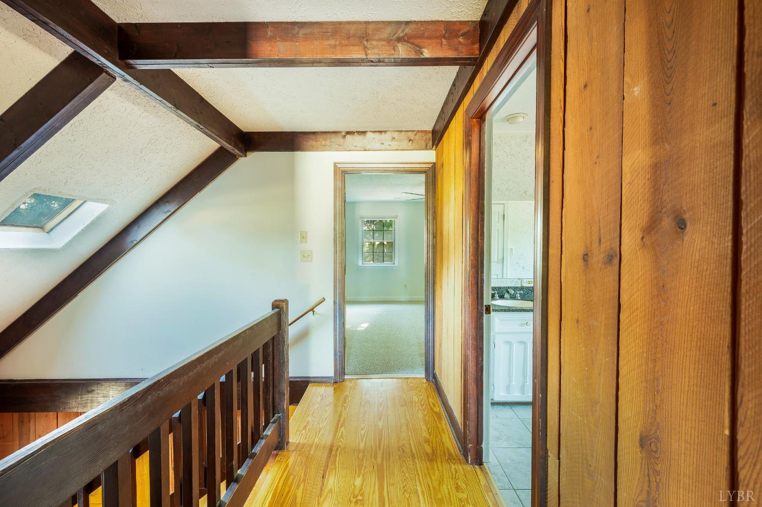 1139 Macon Loop Lynchburg, VA 24503 - Photo 29 of 63 a view of a hallway with wooden floor and staircase
