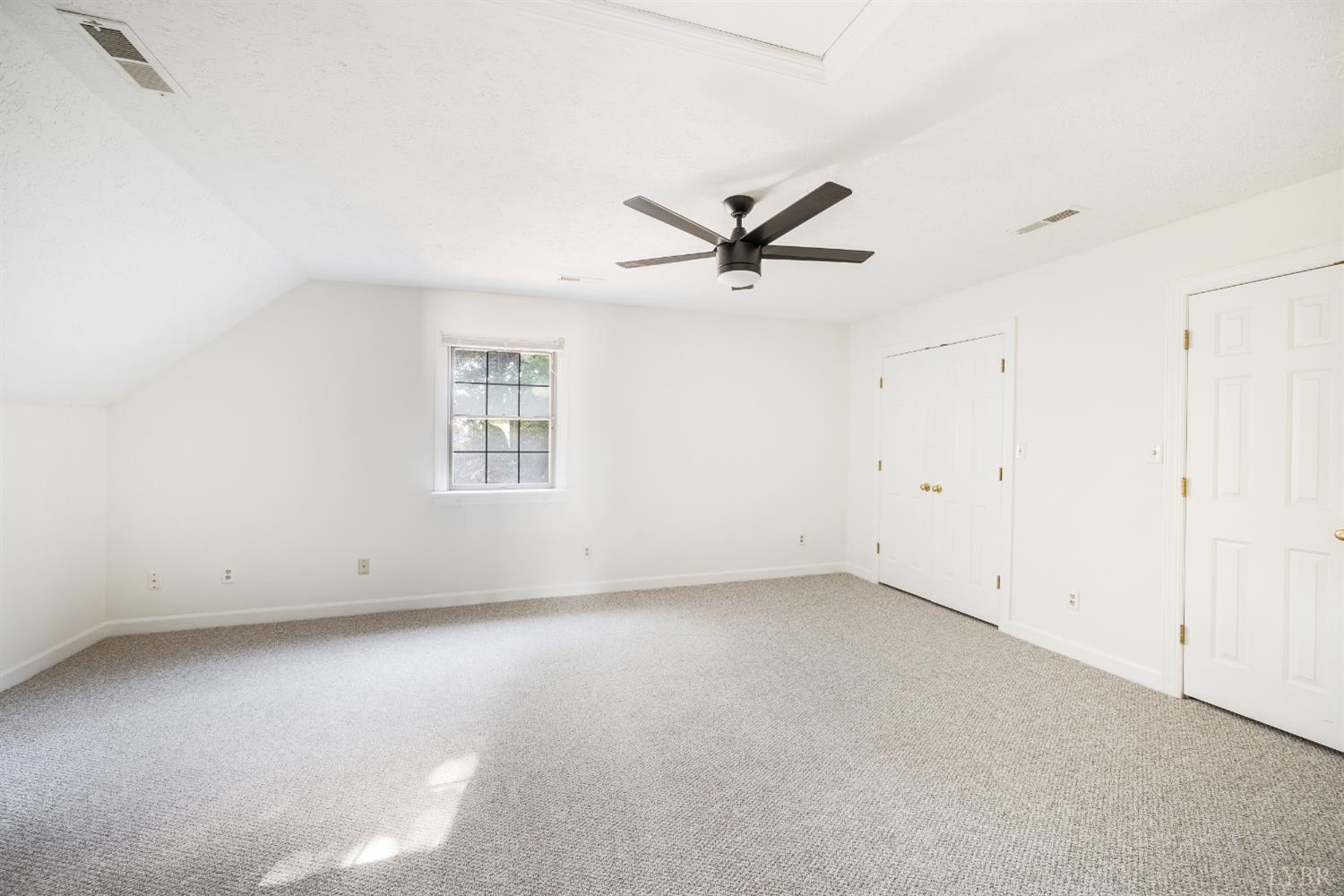 1139 Macon Loop Lynchburg, VA 24503 - Photo 30 of 63 an empty room with a ceiling fan and window