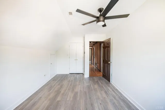 a view of a livingroom with a fireplace and window
