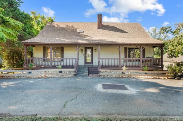 a view of a balcony with wooden floor