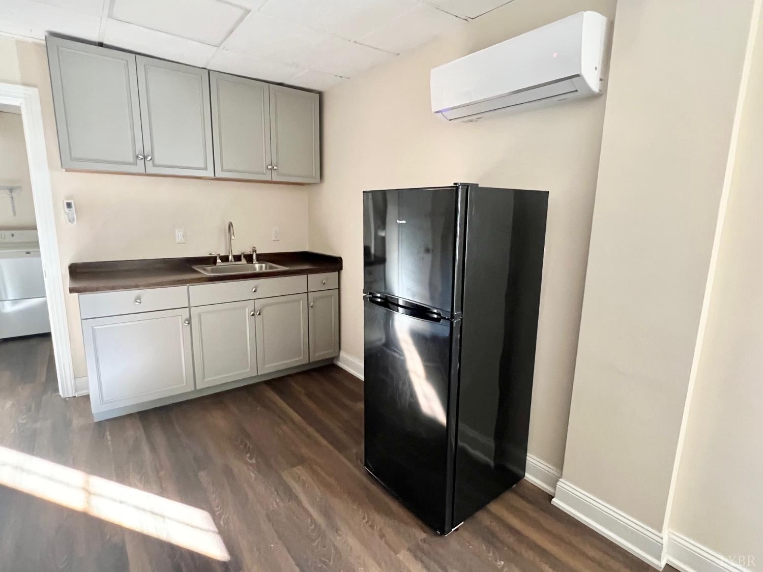 1139 Macon Loop Lynchburg, VA 24503 - Photo 51 of 63 a kitchen with stainless steel appliances granite countertop a refrigerator and a sink