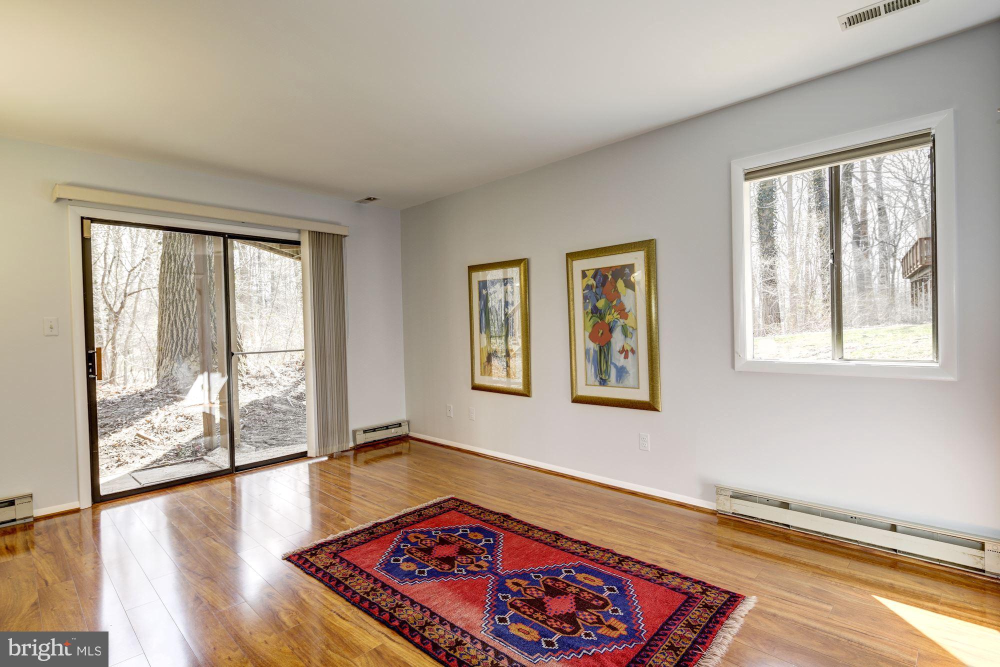 9510 Good Lion Road Columbia, MD 21045 - Photo 49 of 63 MASTER BEDROOM WITH SLIDER WALK OUT AND LARGE WIND
