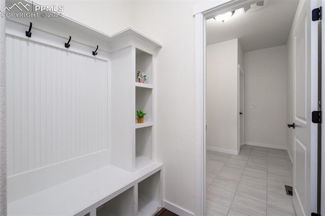 1940 Ruffino Drive Colorado Springs, CO 80921 - Photo 28 of 47 Mudroom from garage with shiplap area/cove with seating bench and room for lots of shoes! Leads into the laundry room.