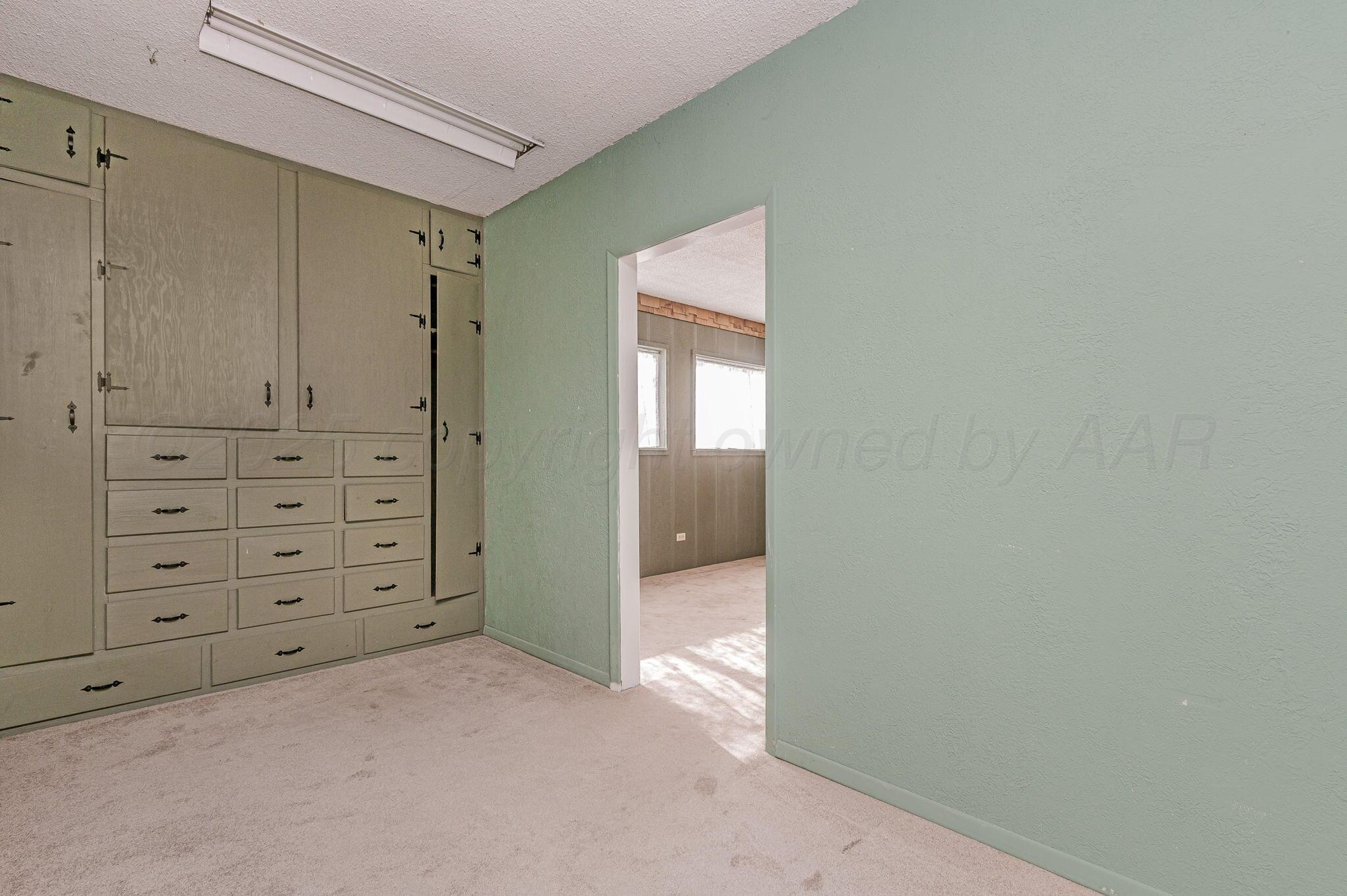 4701 Mesa Circle Amarillo, TX 79109 - Photo 12 of 20 a view of a hallway with closet