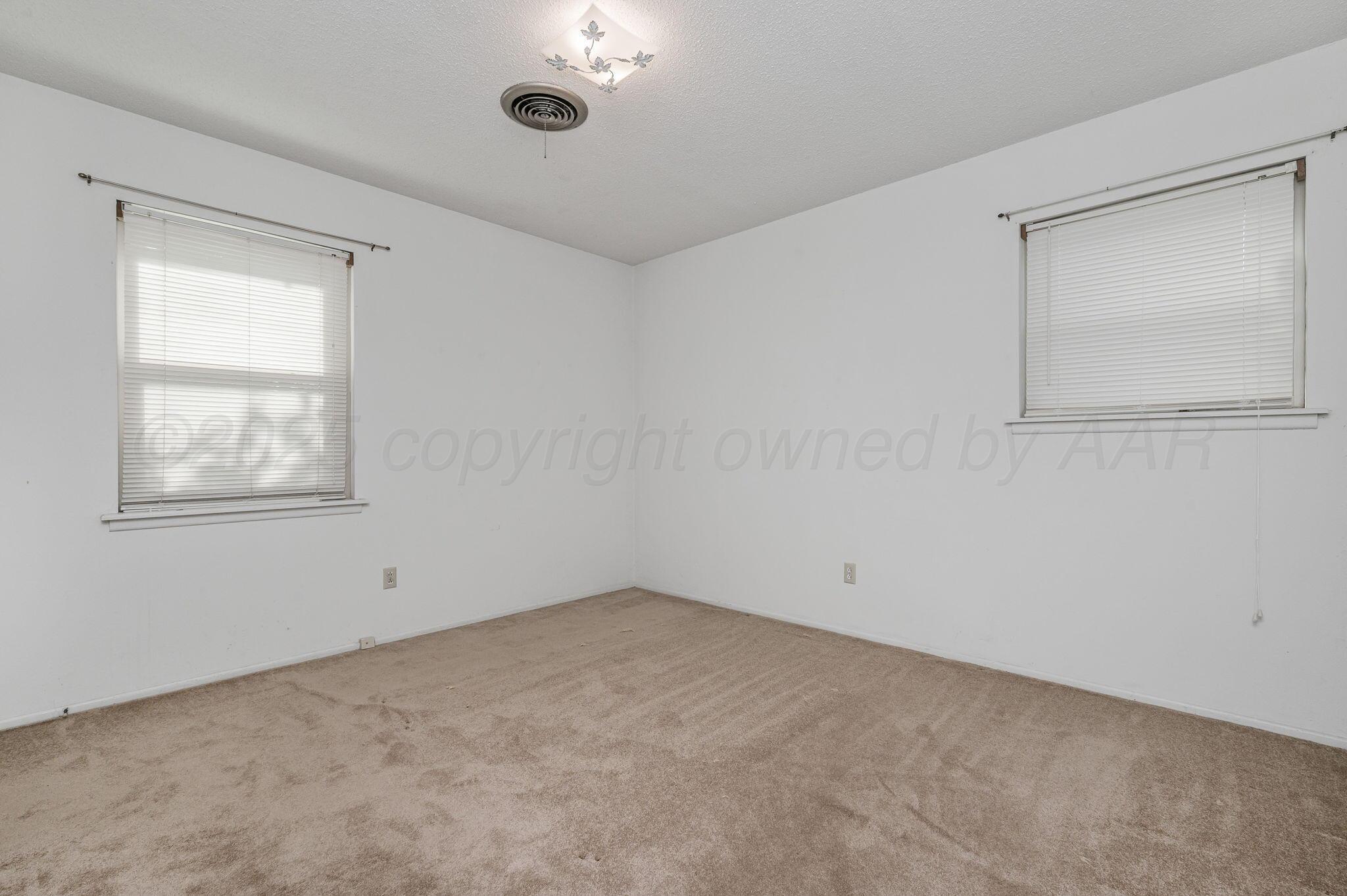 4701 Mesa Circle Amarillo, TX 79109 - Photo 16 of 20 a view of an empty room with a window