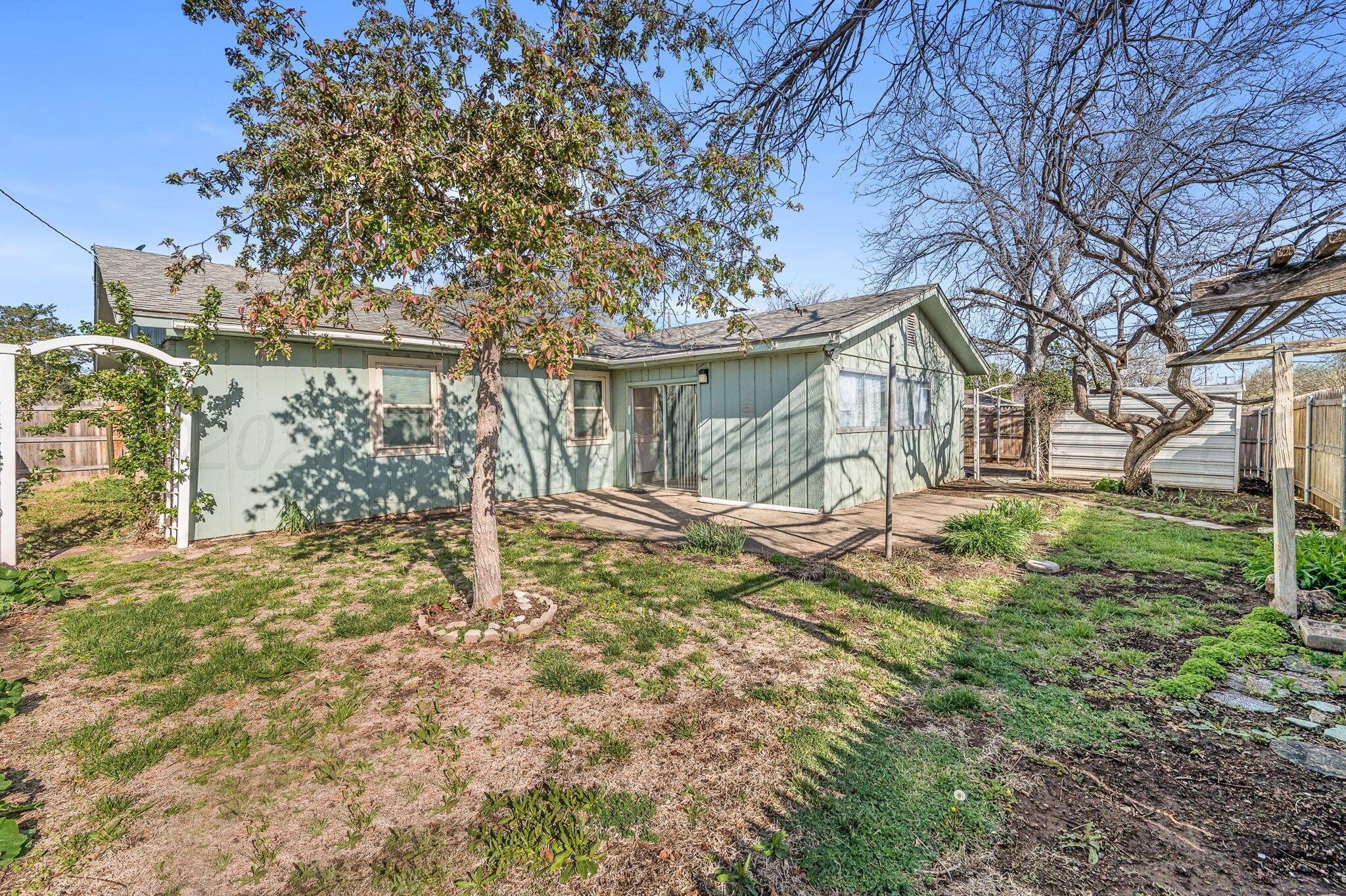 4701 Mesa Circle Amarillo, TX 79109 - Photo 20 of 20 a view of a house with a yard