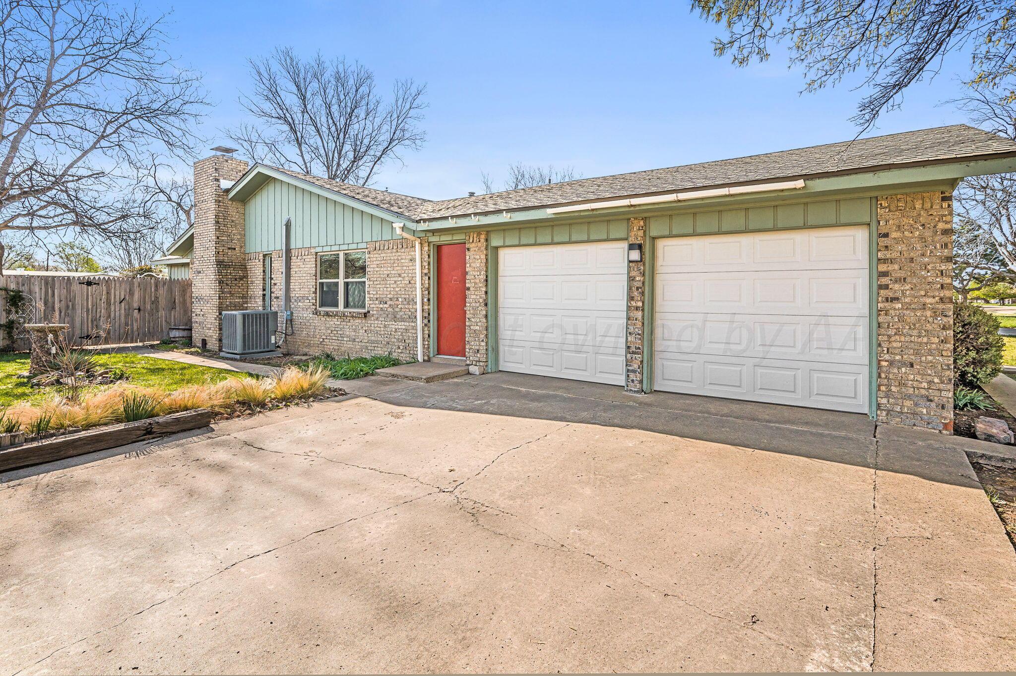 4701 Mesa Circle Amarillo, TX 79109 - Photo 3 of 20 a view of backyard with a large tree