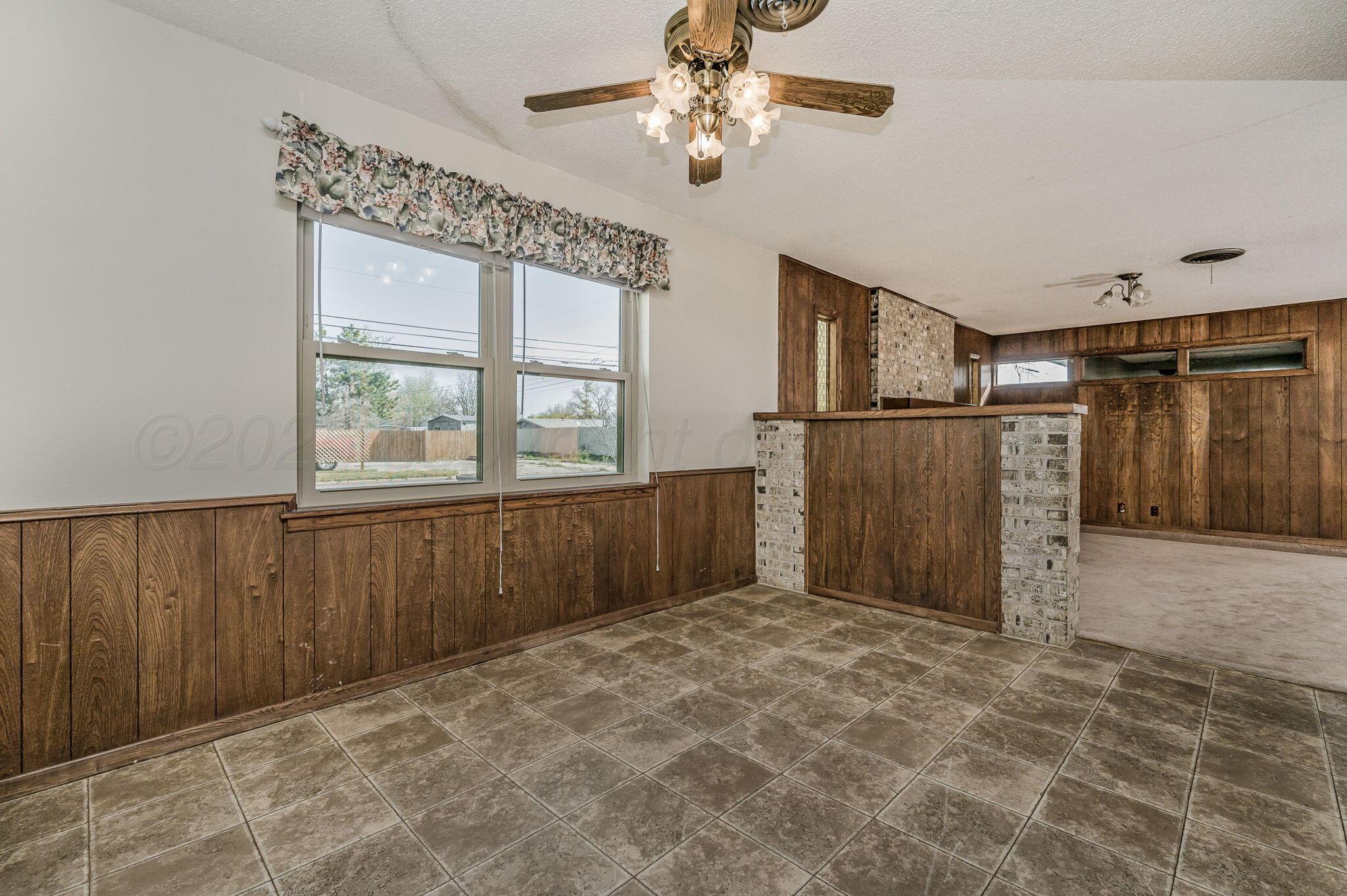 4701 Mesa Circle Amarillo, TX 79109 - Photo 7 of 20 a view of an empty room with a window