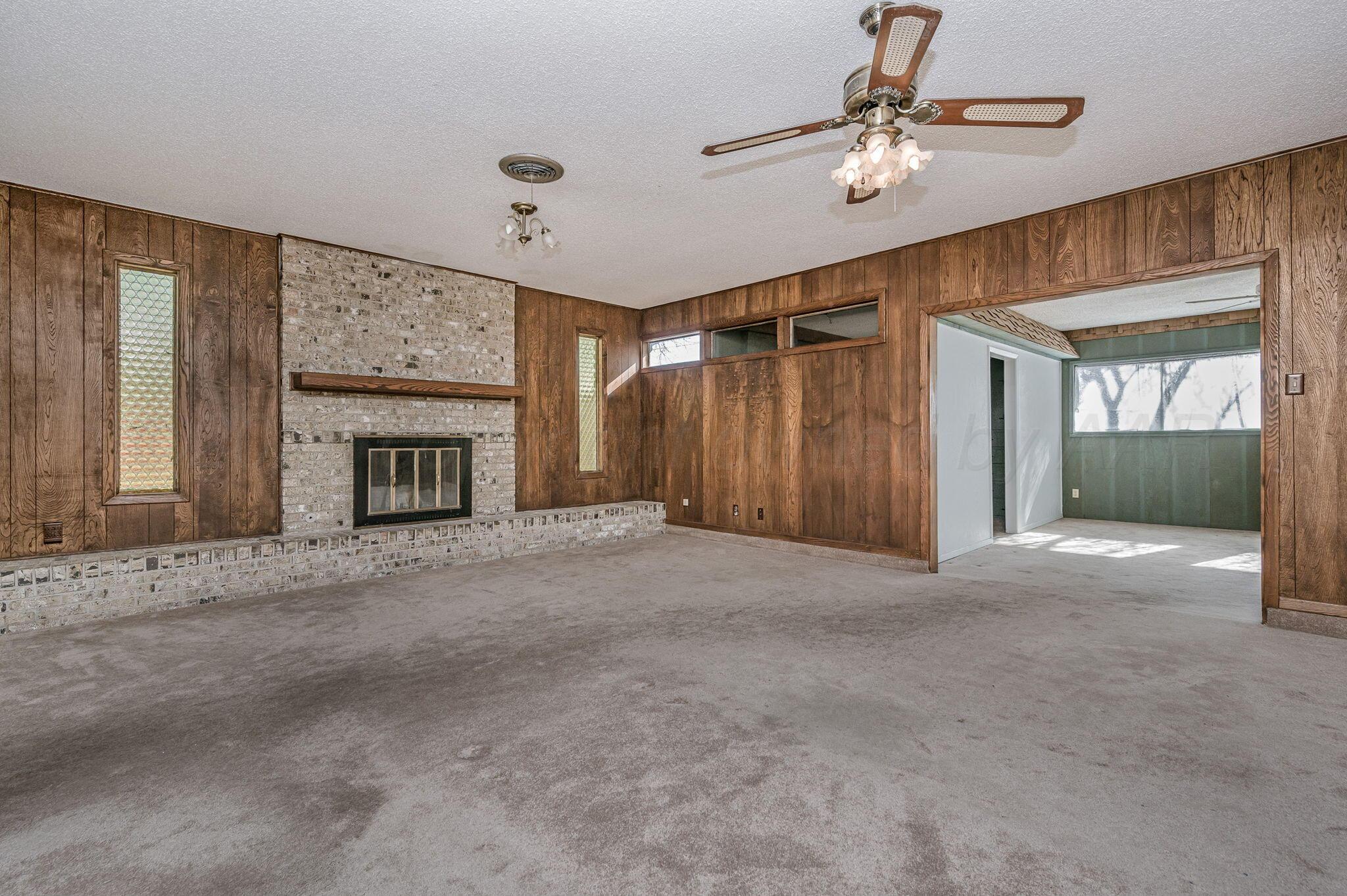 4701 Mesa Circle Amarillo, TX 79109 - Photo 8 of 20 a view of empty room with fireplace and fan