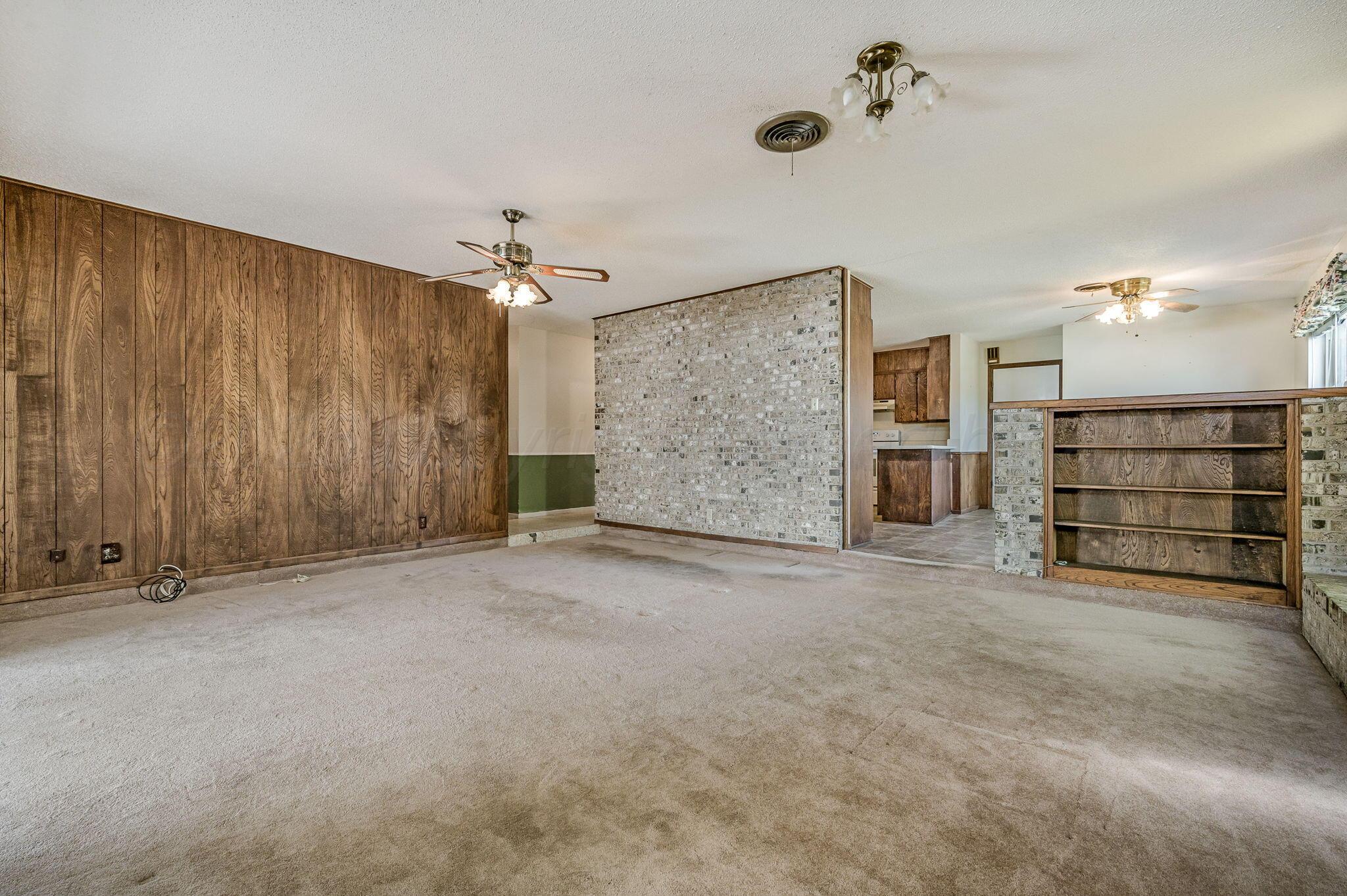 4701 Mesa Circle Amarillo, TX 79109 - Photo 9 of 20 an empty room with a cabinet and mirrors