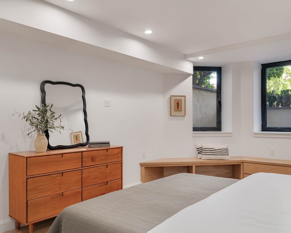 1618 Beacon Street, Unit 1 Brookline, MA 02446 - Photo 25 of 29 a bedroom with a bed and a dresser