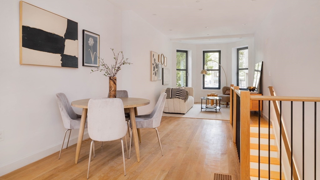 1618 Beacon Street, Unit 1 Brookline, MA 02446 - Photo 10 of 29 a view of a dining room with furniture and wooden floor
