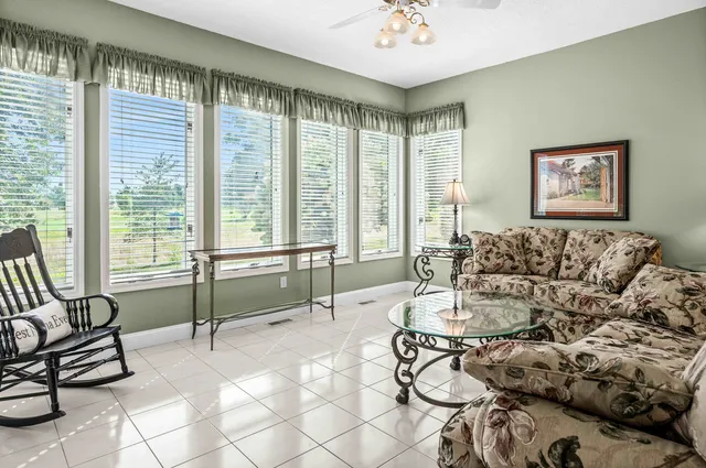 a living room with fireplace furniture and a flat screen tv