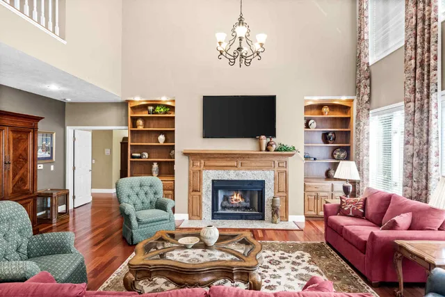 a bathroom with a granite countertop toilet a sink and mirror