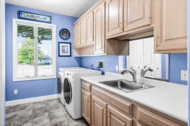 a living room with furniture a clock and a window