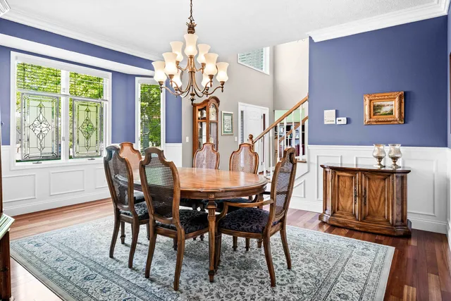 a living room with furniture cabinets and window