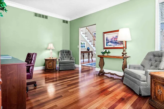 a view of a house with backyard porch and sitting area