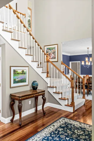 a kitchen with kitchen island granite countertop a sink a counter top space and cabinets