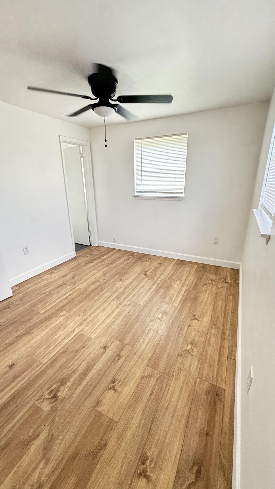 3945 Ocala Road Lake Worth, FL 33462 - Photo 13 of 18 a view of an empty room with a window