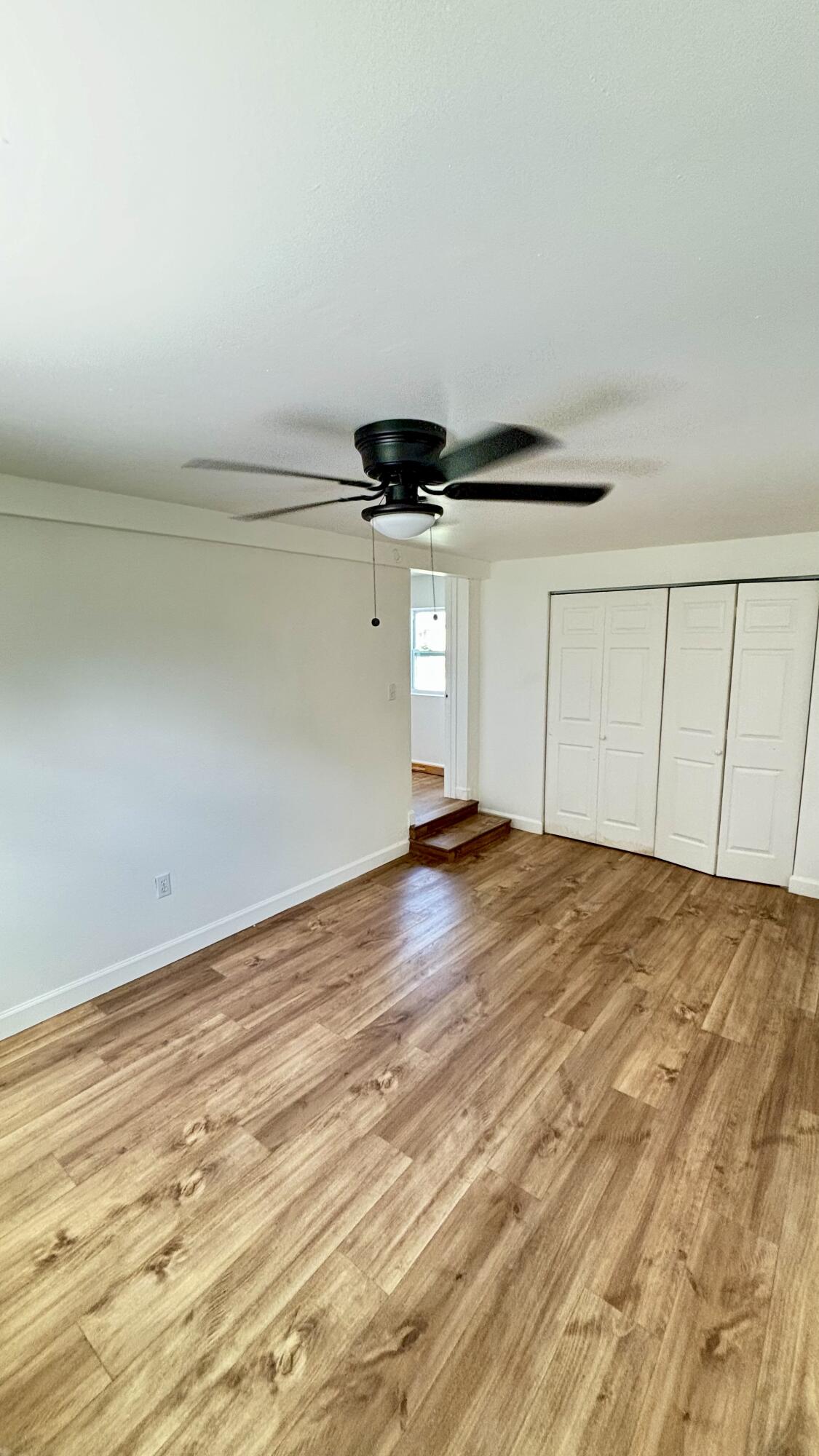 3945 Ocala Road Lake Worth, FL 33462 - Photo 6 of 18 a view of empty room with wooden floor