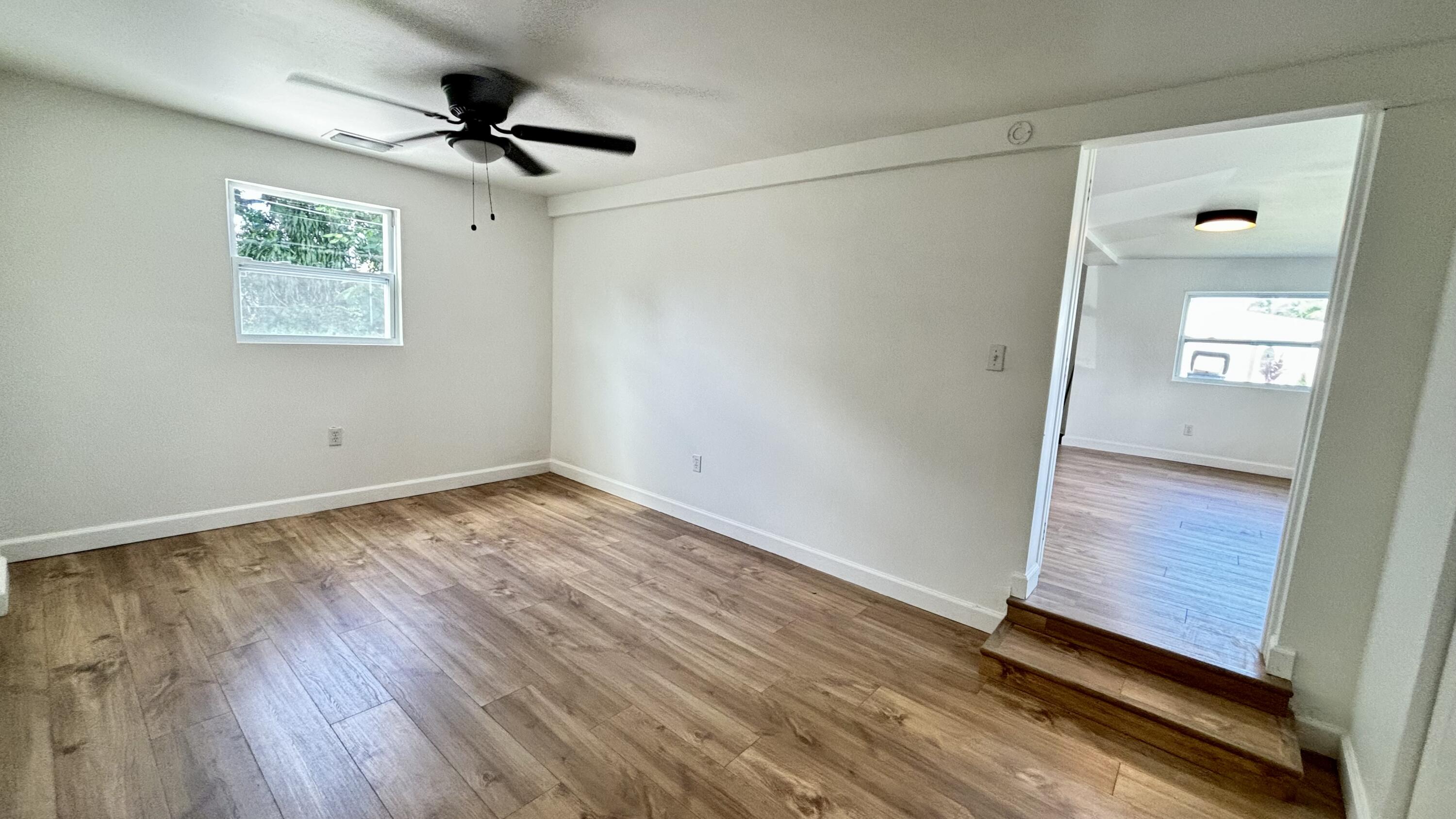 3945 Ocala Road Lake Worth, FL 33462 - Photo 7 of 18 a view of empty room with wooden floor