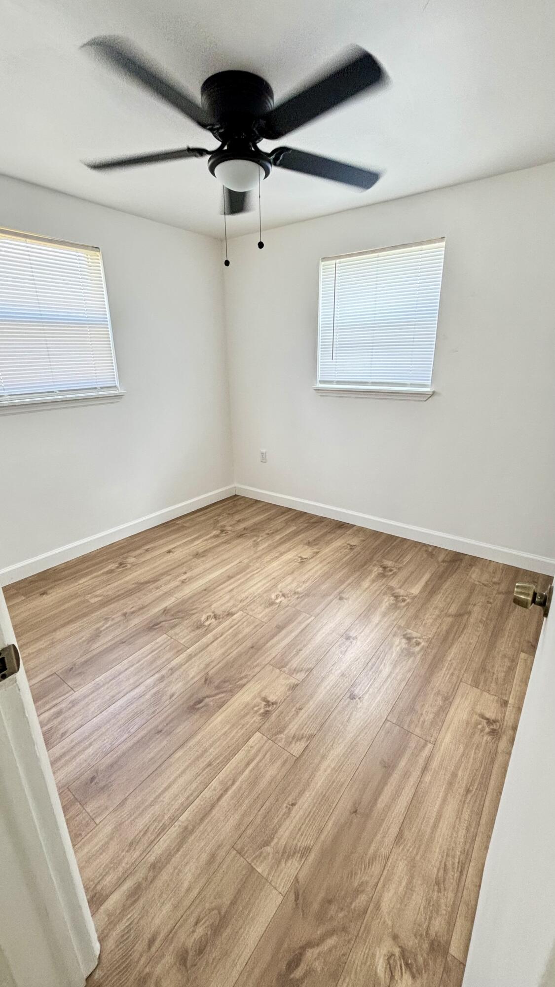 3945 Ocala Road Lake Worth, FL 33462 - Photo 10 of 18 a view of an empty room with a chandelier fan