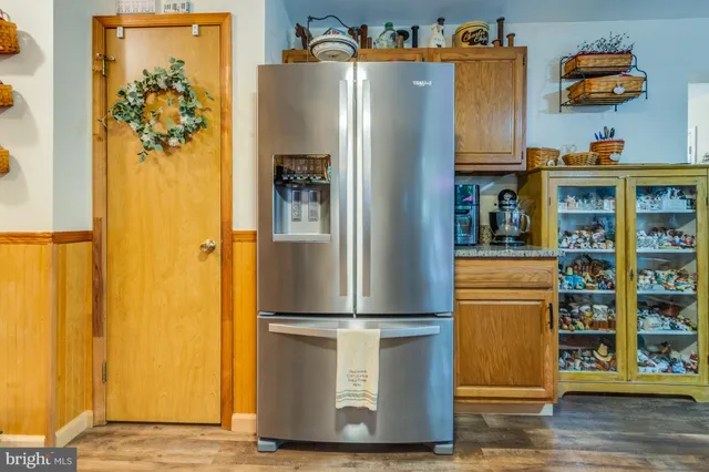 a kitchen with a refrigerator and a stove