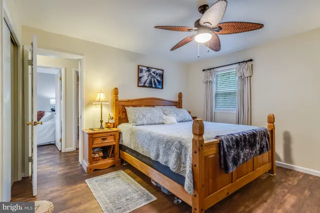 a bed room with a bed and a chandelier
