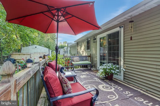 a view of an outdoor sitting area with brick walls