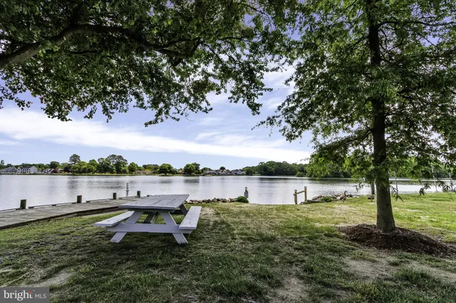 a lake view with a building in the background