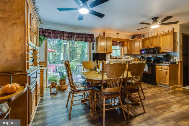 a view of a dining room with furniture window and outside view