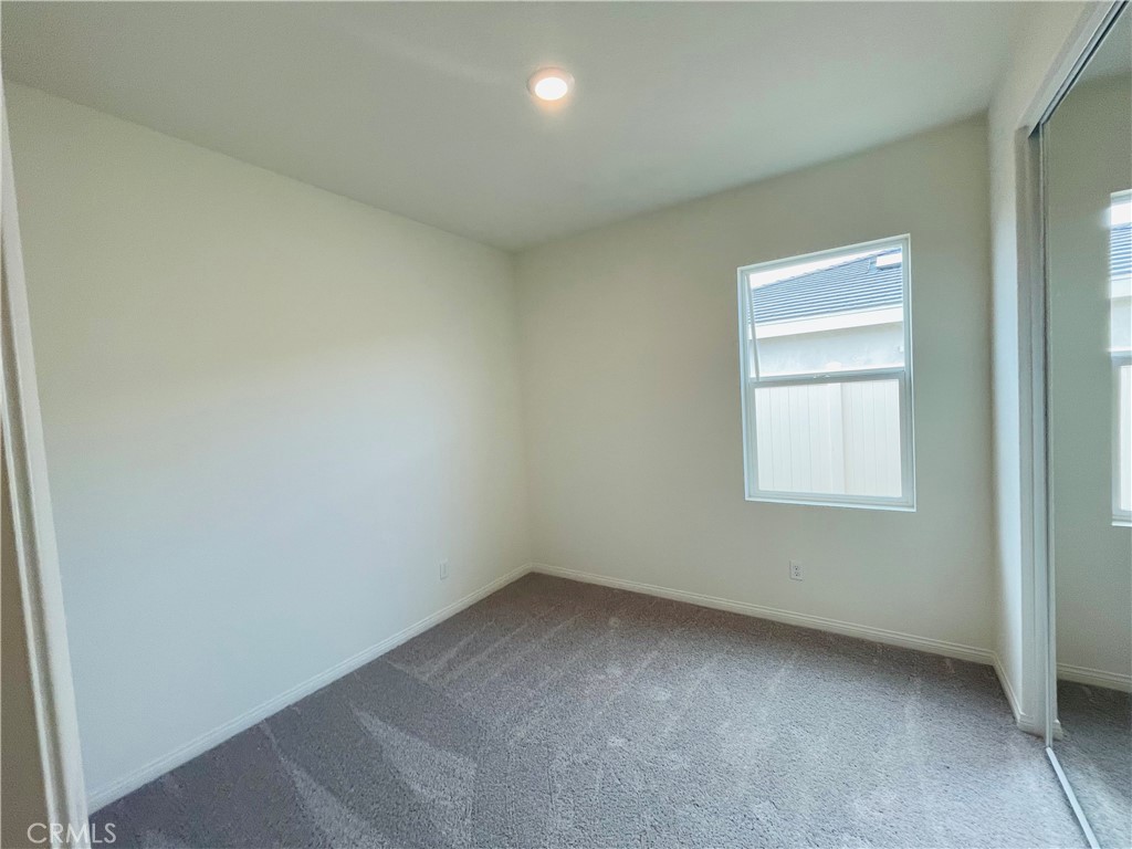 19770 Barnfield Place Riverside, CA 92507 - Photo 13 of 22 an empty room with a window