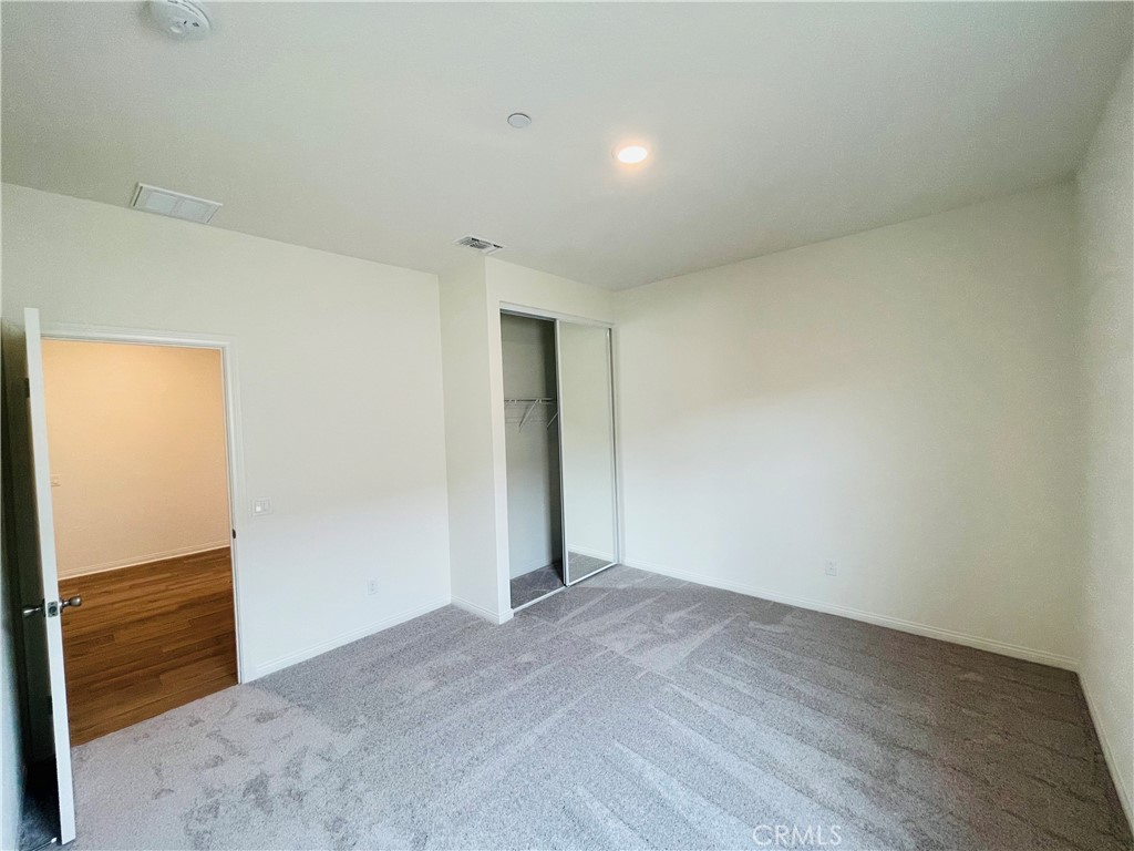 19770 Barnfield Place Riverside, CA 92507 - Photo 16 of 22 an empty room with wooden floor
