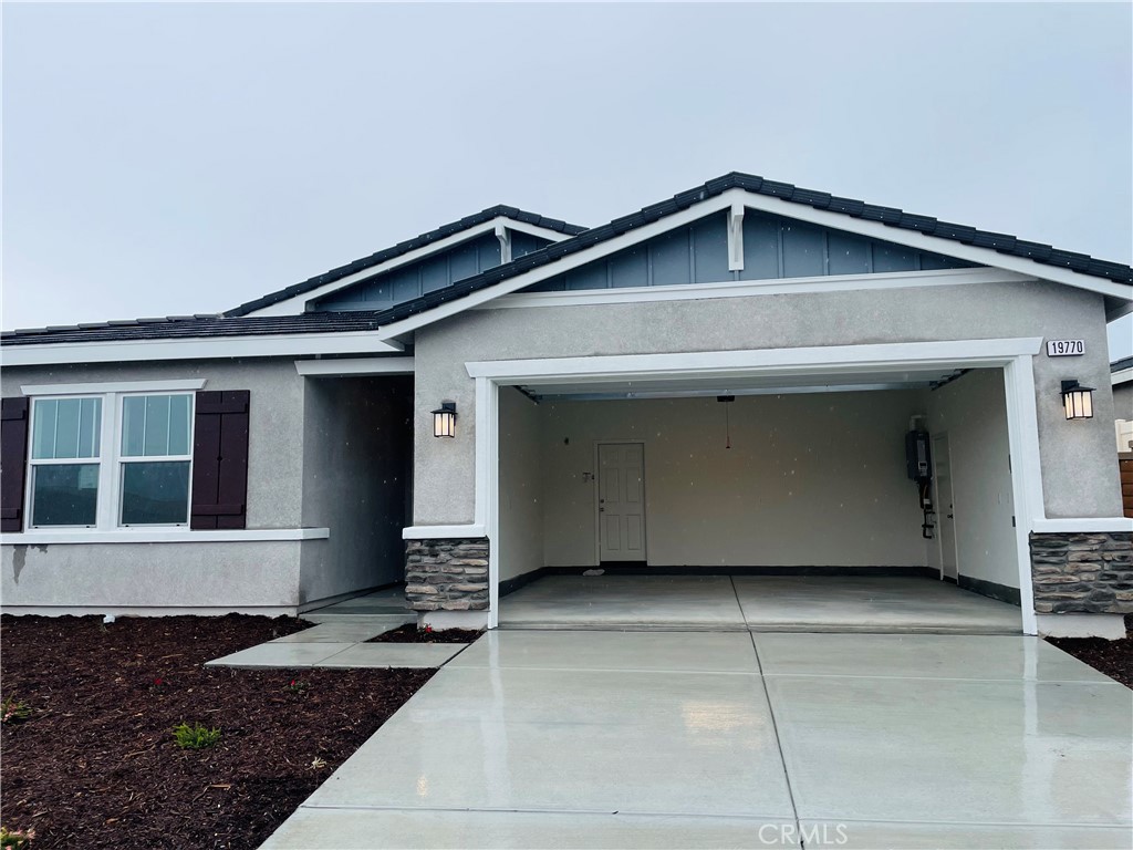 19770 Barnfield Place Riverside, CA 92507 - Photo 2 of 22 a view of a house with parking space