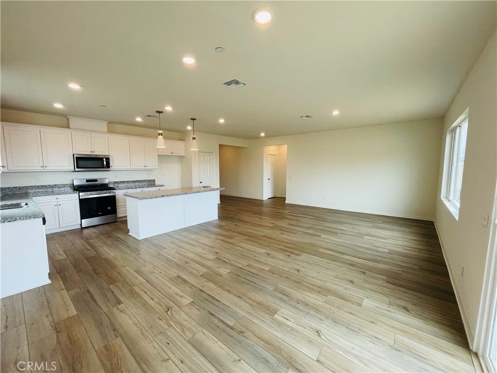 19770 Barnfield Place Riverside, CA 92507 - Photo 5 of 22 a view of kitchen with wooden floor