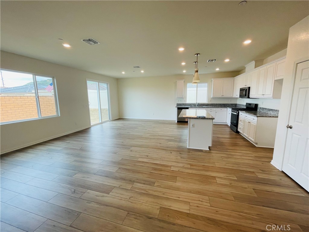 19770 Barnfield Place Riverside, CA 92507 - Photo 8 of 22 a view of kitchen with sink and wooden floor