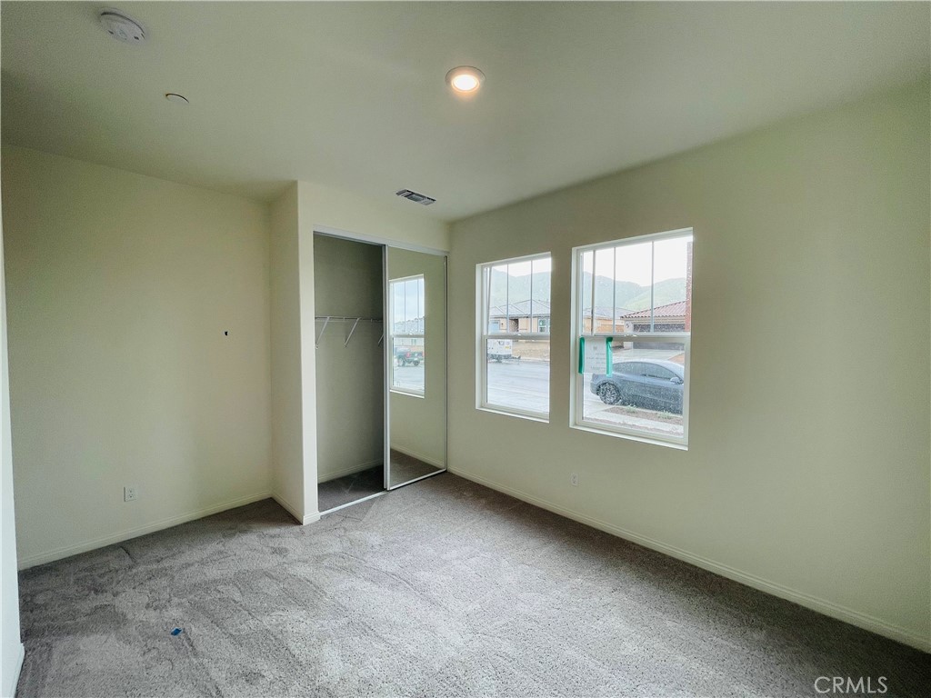 19770 Barnfield Place Riverside, CA 92507 - Photo 10 of 22 an empty room with windows