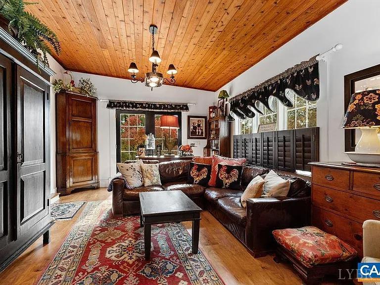 325 Old Roseland Road Roseland, VA 22967 - Photo 10 of 69 a living room with furniture a fireplace and a chandelier