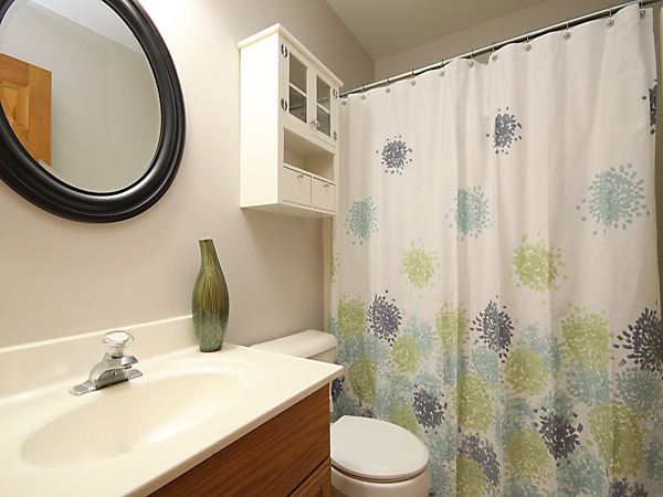 2107 High Meadow Road Naperville, IL 60564 - Photo 17 of 25 a bathroom with a sink a toilet and a mirror