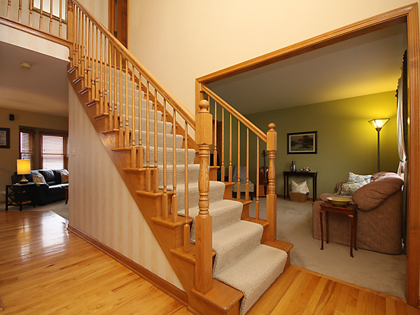 2107 High Meadow Road Naperville, IL 60564 - Photo 3 of 25 a view of entryway and hall with wooden floor